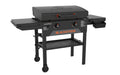 Side view of Blackstone 28-inch Omni griddle with foldable side shelves, hood closed