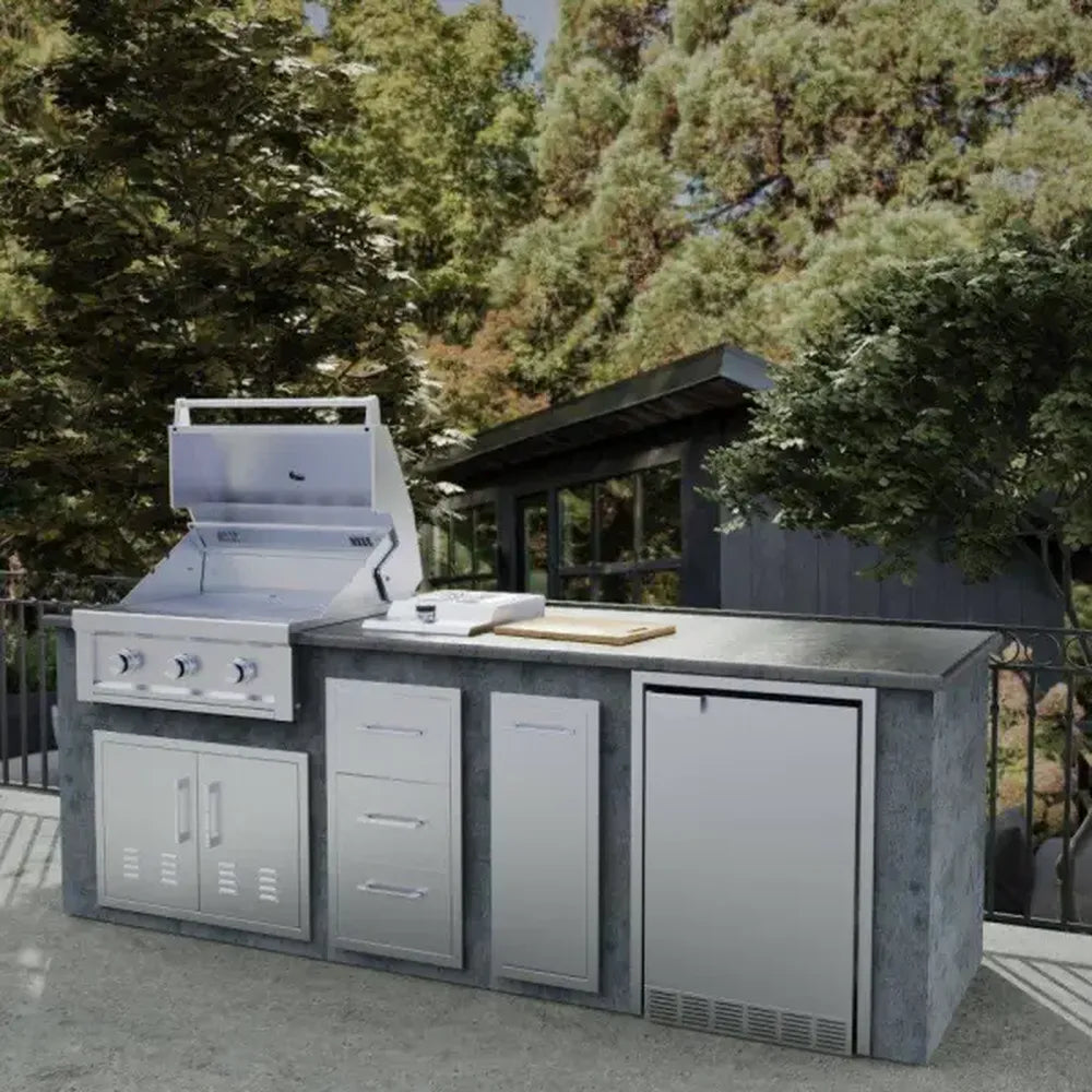 Sunstone 21-inch stainless fridge trim installed in outdoor kitchen island beside grill and cabinets, 304 SS built-in appliance trim.