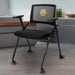 Triton poker chair in a room setting with mesh back, padded armrests, cushioned seat, and rolling wheels.