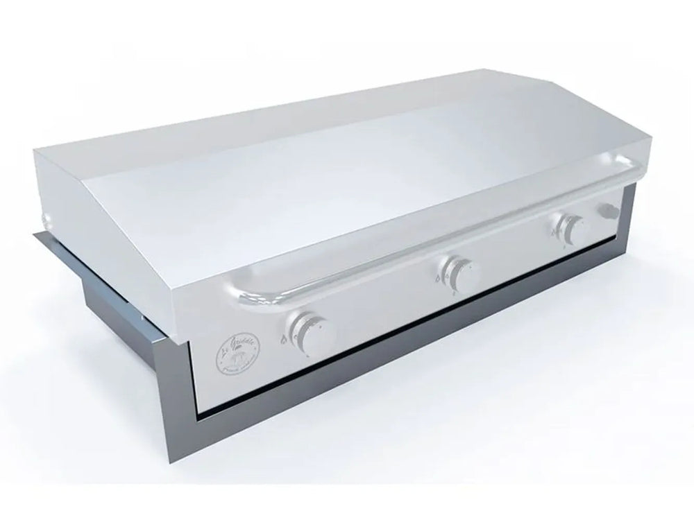 Le Griddle 41" griddle being installed into the insulated liner, angle view showing heat protection for cabinet.