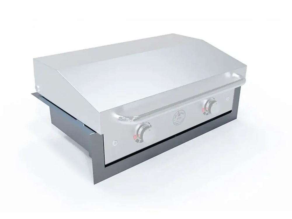 Le Griddle 30" Ranch Hand griddle being installed into the insulated liner, angle view showing heat protection for cabinet.