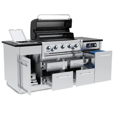 Broil King Imperial QS 590i luxury gas grill island with dual open ovens, side burner, and fully extended storage drawers.