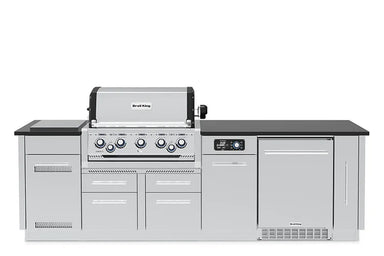 Front view of the fully assembled Broil King Imperial QS 590iF Smart Grill Island with black countertop and stainless steel cabinetry.