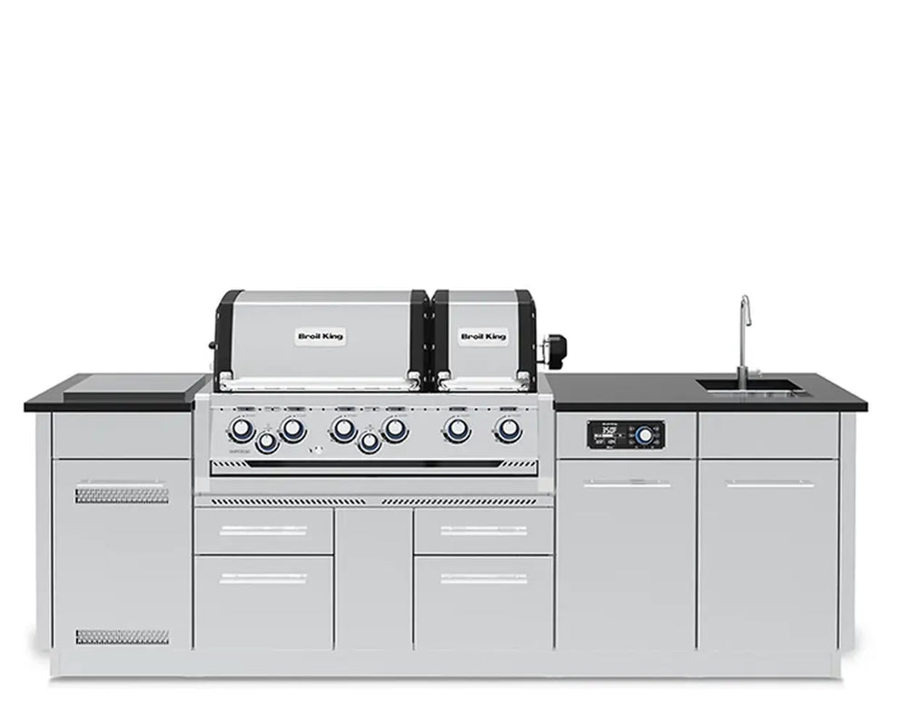 Front profile of the fully assembled Broil King Imperial QS 690iE Smart Grill Island featuring a dual-hood grill, digital control panel, side burner, and sink.