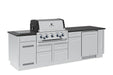 Angled right view of the Broil King Imperial S 590iF built-in gas grill island, highlighting the integrated outdoor fridge, sleek stainless steel finish, and ample prep space.