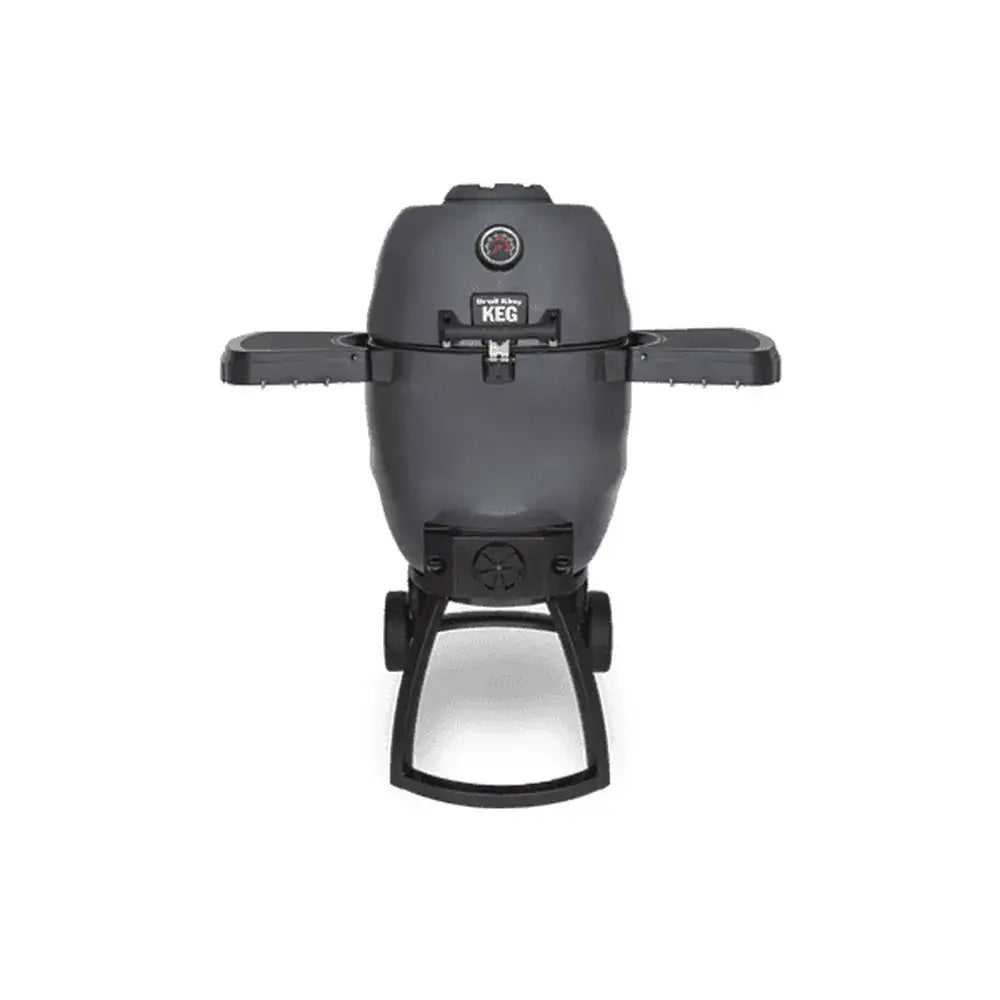 Broil King Keg 5000 kamado charcoal grill with dual side shelves, front thermometer, and wheeled stand on a light gray background.