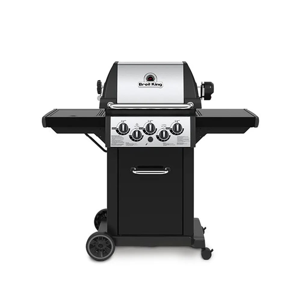 Broil King Monarch 390 gas grill with side burner, front view showing stainless steel lid, three main burner knobs plus side burner controls, black side shelves, enclosed cabinet, and wheeled cart