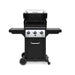 Broil King Monarch 320 freestanding gas grill with lid open, showing primary cooking grates, warming rack, three-burner cook box, and black cart with wheels