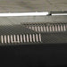 Heavy-duty stainless steel cooking grids featuring a multilevel surface for versatile temperature control on the Broilmaster grill