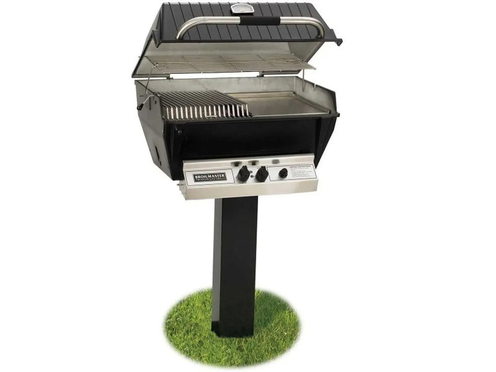 Broilmaster 25-inch grill open on a permanent post mount with half stainless steel grate and half griddle plate accessory
