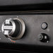 Close-up of Blackstone pizza oven ignition dial with textured control knob and power button