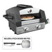 Blackstone propane tabletop pizza oven cooking a pepperoni pizza with included rocker and peel shown