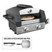 Blackstone propane tabletop pizza oven cooking a pepperoni pizza with included rocker and peel shown