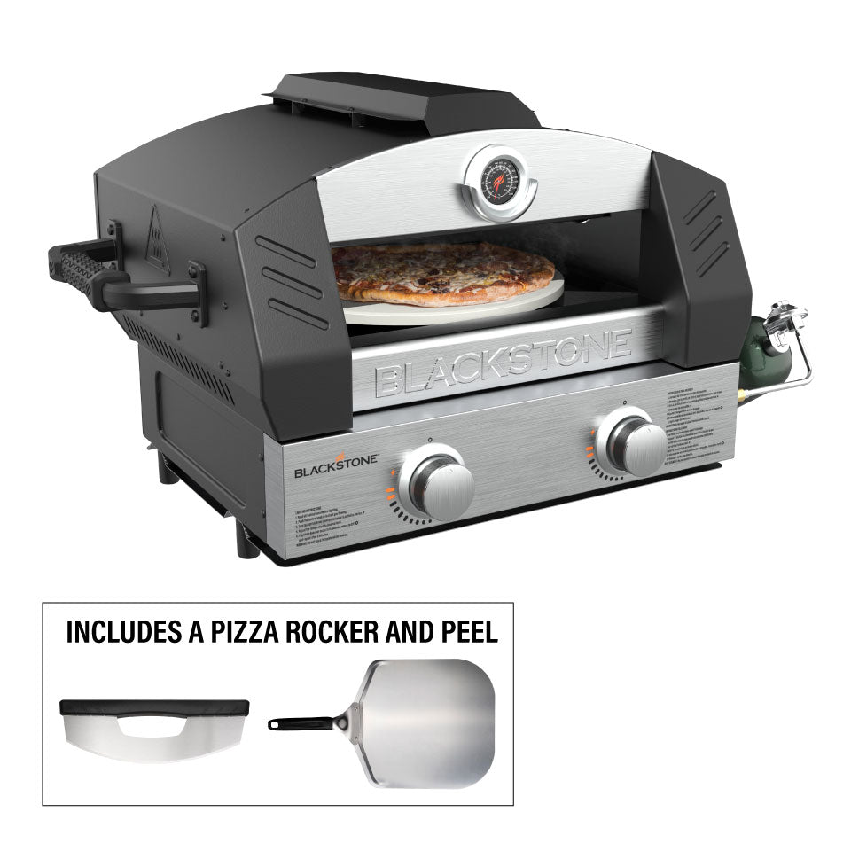 Blackstone propane tabletop pizza oven cooking a pepperoni pizza with included rocker and peel shown