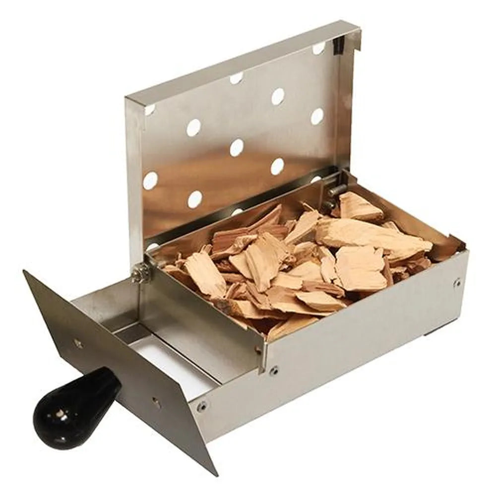 Stainless steel smoker box accessory filled with wood chips for adding smoke flavor to food on the Broilmaster grill