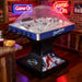 Hathaway Breakaway Dome Hockey table set up in a man cave with neon "Game On" sign, snacks, and a beer, emphasizing a fun gaming atmosphere.