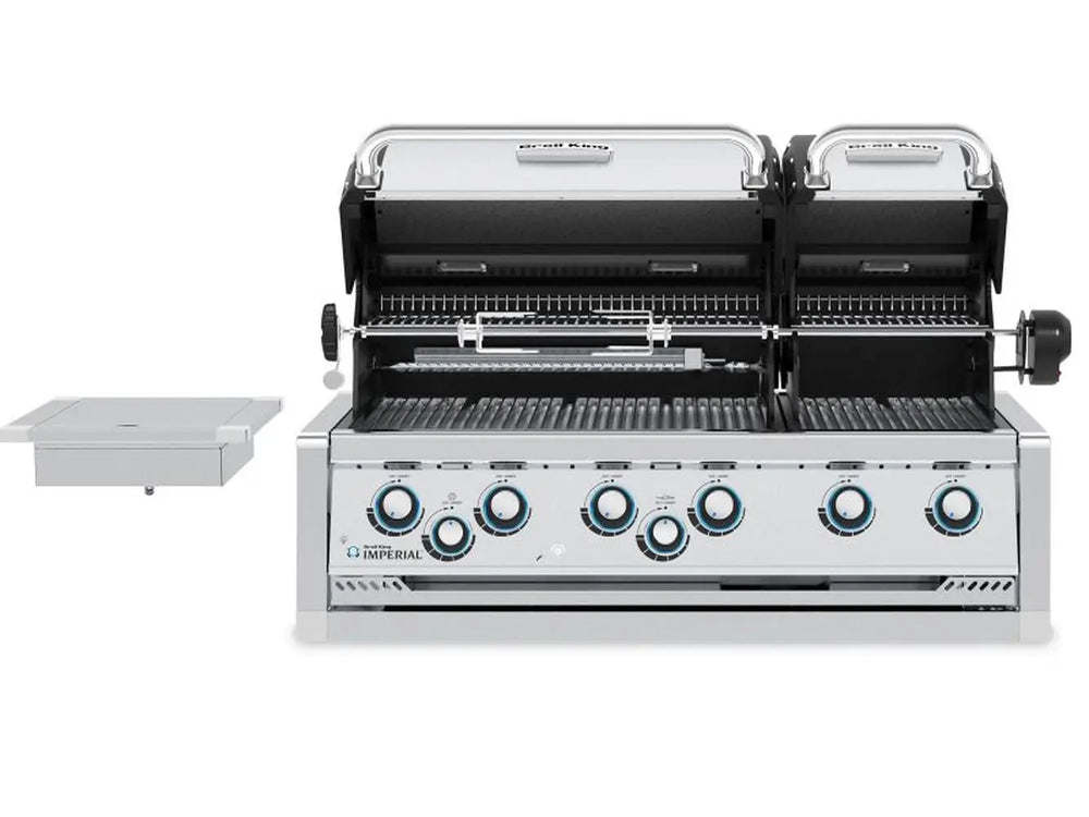 Open dual-hood view of Broil King Imperial S 690i built-in grill showing rotisserie kit and stainless steel grates.