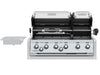 Open dual-hood view of Broil King Imperial S 690i built-in grill showing rotisserie kit and stainless steel grates.