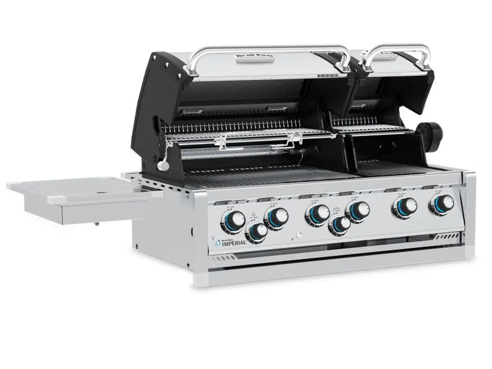 Angled perspective of the Broil King Imperial S 690iH built-in grill head with open lids and attached side burner.
