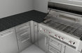 Close-up installation of the Sunstone SCC3SP90 corner spacer panel connecting two stainless steel outdoor kitchen cabinets at a 90-degree angle under a granite countertop.