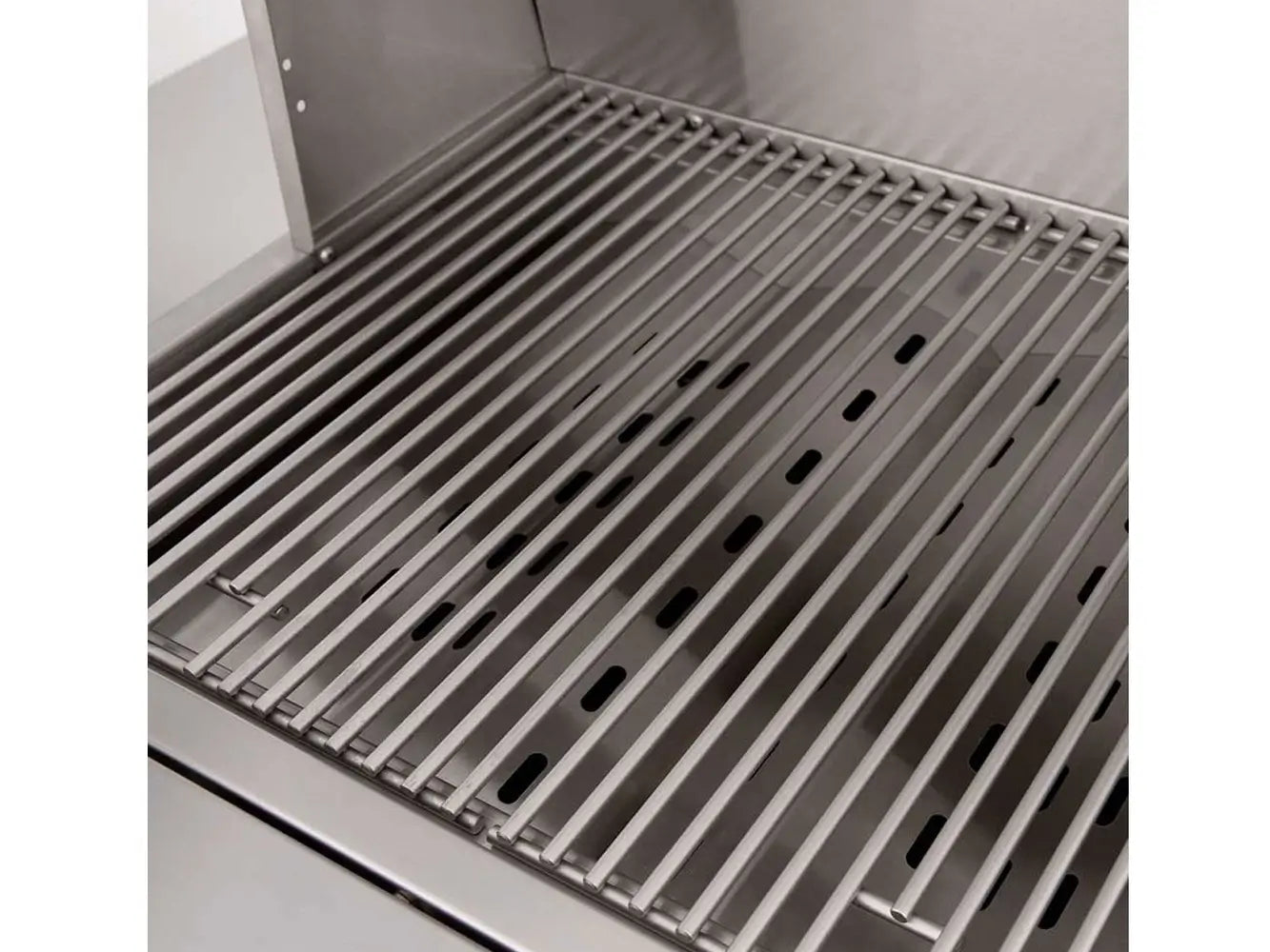 Close-up of stainless steel cooking grates inside outdoor gas grill.