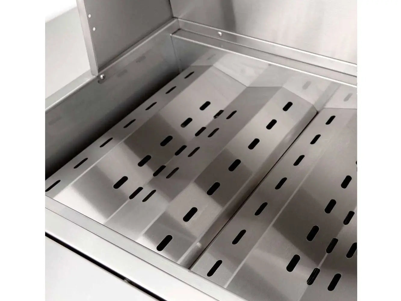 Stainless steel heat deflector plates inside built-in outdoor gas grill.