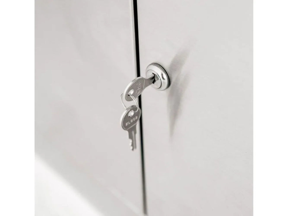 Close-up of the key-lock security feature on the cabinet door of the Summerset Resort 30" stainless steel grill pedestal.