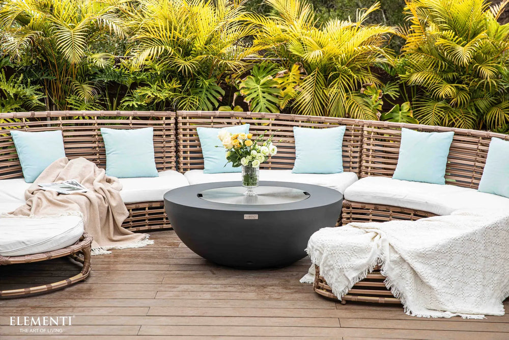 Circular stainless steel lid accessory covering the burner of an Elementi fire pit bowl.