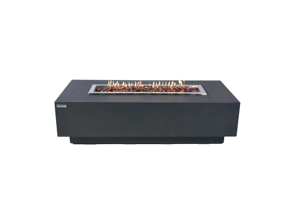 Lit Elementi Granville OFG121DG Fire Table 60" Dark Gray with lava rocks and linear flames on white background.