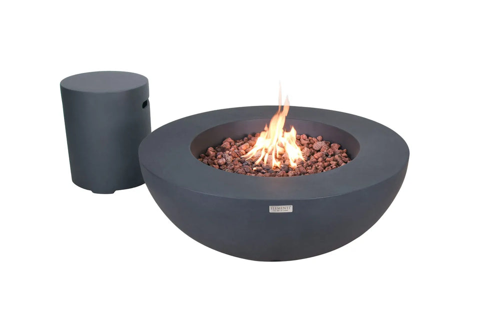 Matching gray concrete Elementi gas tank cover placed next to a burning fire bowl on a patio.