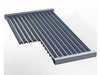 Angled view of Sunstone 10" stainless searing grate showing V-shaped channels for high-heat airflow and searing.