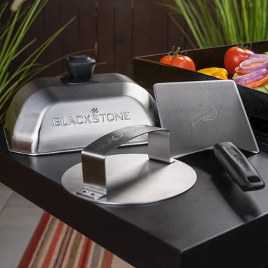 Complete Blackstone Smash Burger Kit with dome, spatula, and press on outdoor griddle station