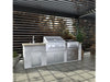 Lifestyle image of a custom outdoor kitchen island featuring the Sunstone SUNJK40 insulated jacket and Ruby 4-Burner infrared gas grill.