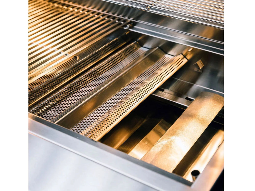 Interior shot of True Flame grill highlighting perforated flame tamers and stainless steel burner protectors beneath cooking grates.