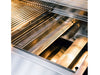 Interior shot of True Flame grill highlighting perforated flame tamers and stainless steel burner protectors beneath cooking grates.