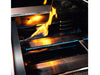 Close-up of True Flame gas grill burner with blue flames and intense orange cooking flames over stainless steel heat diffusers.