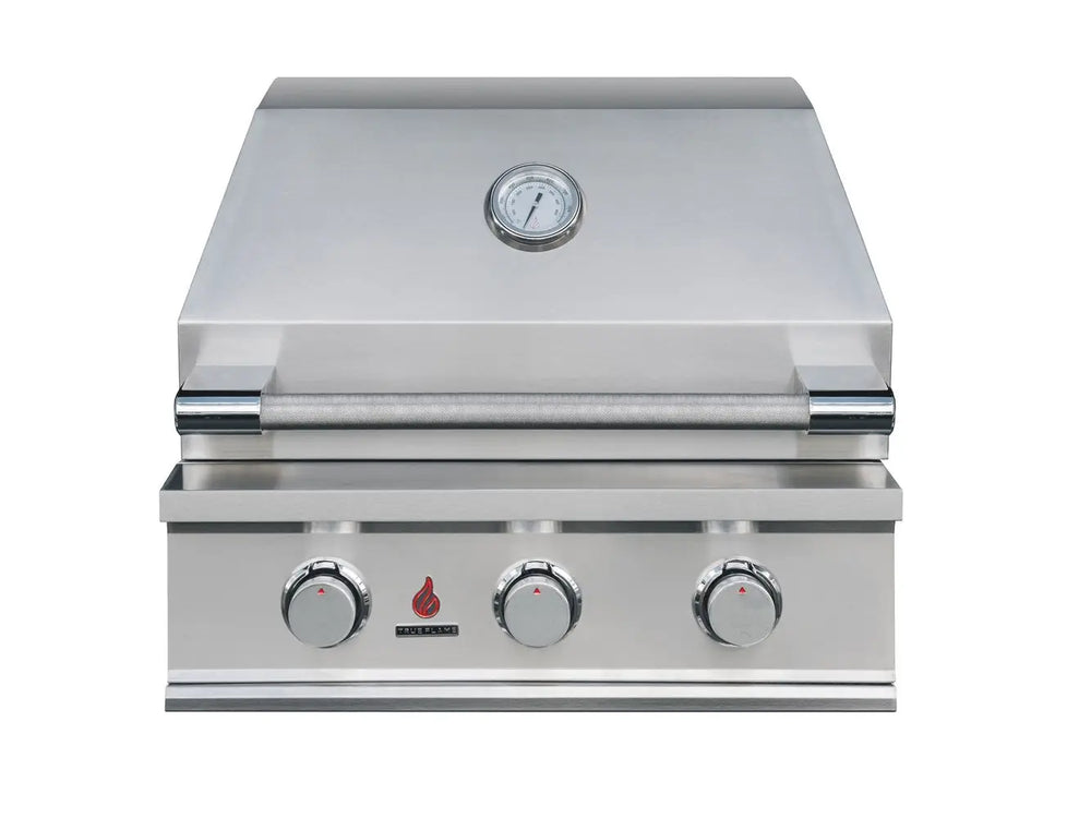 Front view of True Flame stainless steel gas grill with three chrome control knobs and built-in hood thermometer.