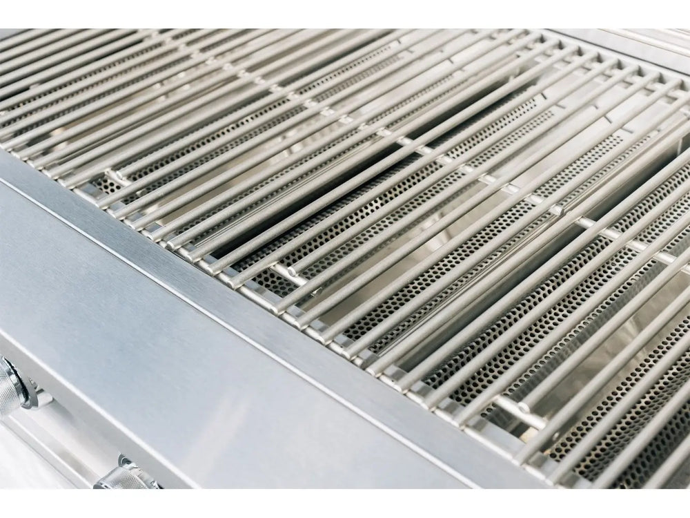 Top-down close-up of True Flame stainless steel cooking grates over perforated flame tamers for even heat distribution.