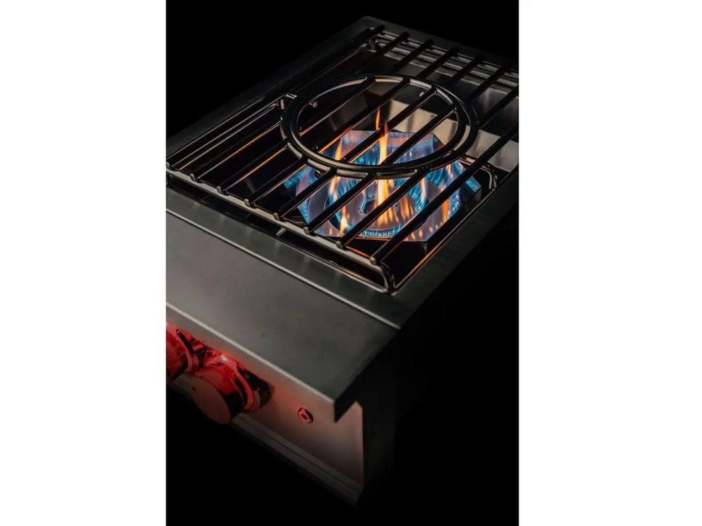 Top view of True Flame wok burner with visible dual ring blue flame and wok-support grate.