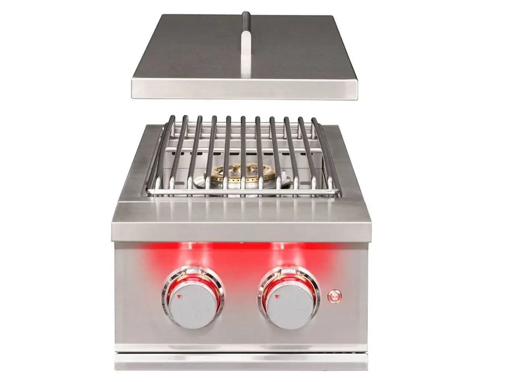 True Flame built-in power burner with open lid, stainless steel grates, dual control knobs, and red LED lighting.