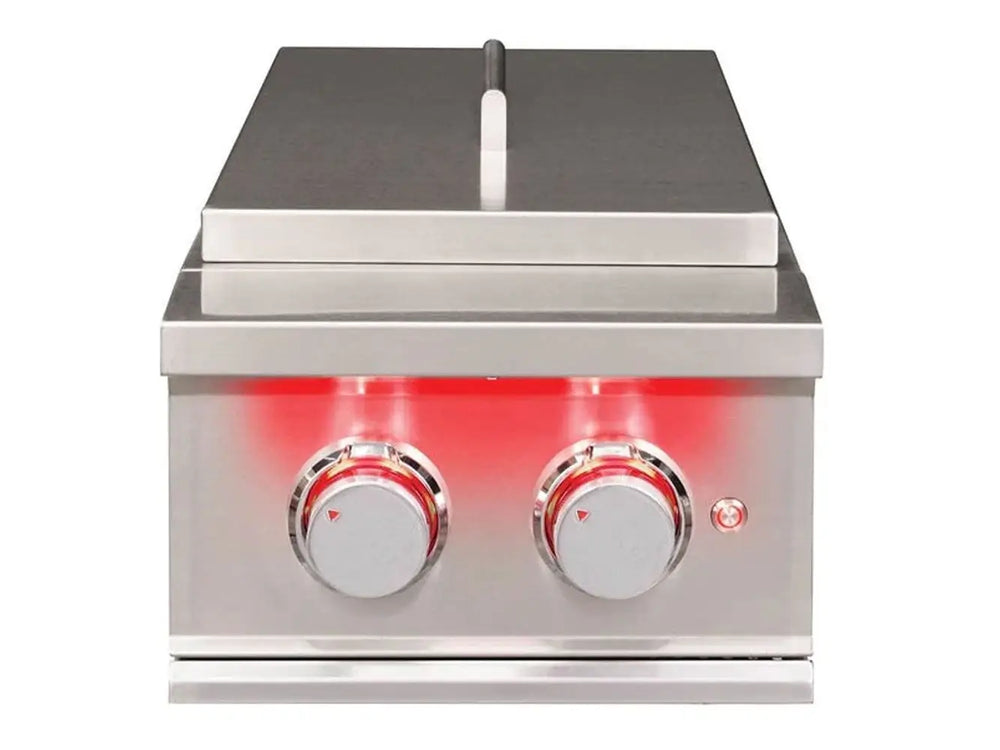 True Flame power burner with closed stainless steel lid and illuminated red control knobs.