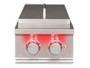 True Flame power burner with closed stainless steel lid and illuminated red control knobs.