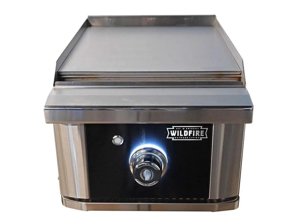 Wildfire Ranch 15″ Black Built-In Side Griddle – 17,000 BTUs with backlit control knob and premium stainless steel finish, ideal for precision night grilling in modern outdoor kitchens.