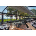 Bromic Wireless Master Remote being used to control outdoor restaurant heaters under a glass roof patio.