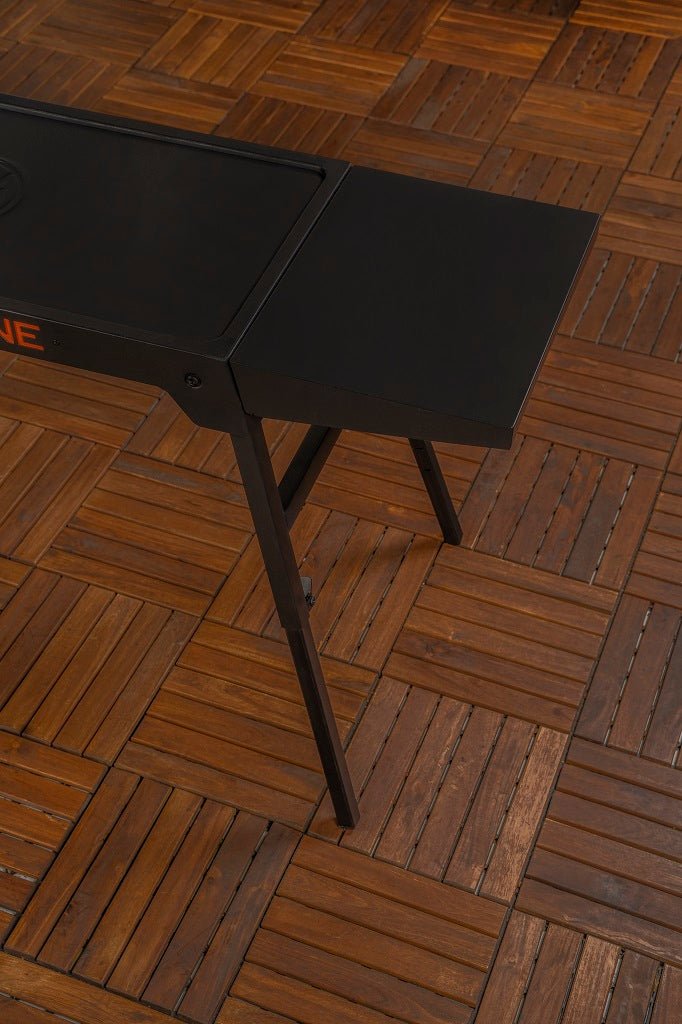 Close-up of the removable side shelf on the Blackstone Omni Leg Stand for extra prep and workspace