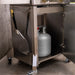 Rear exhaust view of portable pizza oven showing chimney ventilation and fuel acces